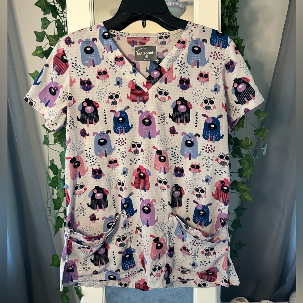 pink, blue, purple, and white pups extra small scrub top! brand: butter-soft